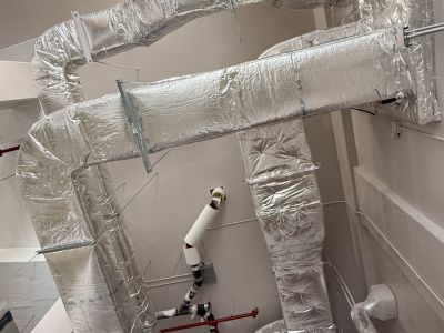 Chiller with insulated end bell Chiller with black insulated end bell installed by Metro Insulation in a Toronto high-rise mechanical room
