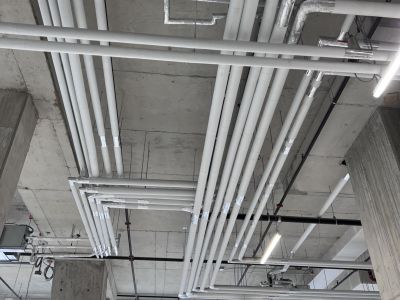 Insulated piping with valves Insulated piping with red valves installed by Metro Insulation in a high-rise mechanical room