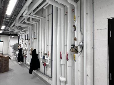 Insulated ceiling pipe runs Insulated ceiling pipe runs installed by Metro Insulation in a Toronto high-rise mechanical room